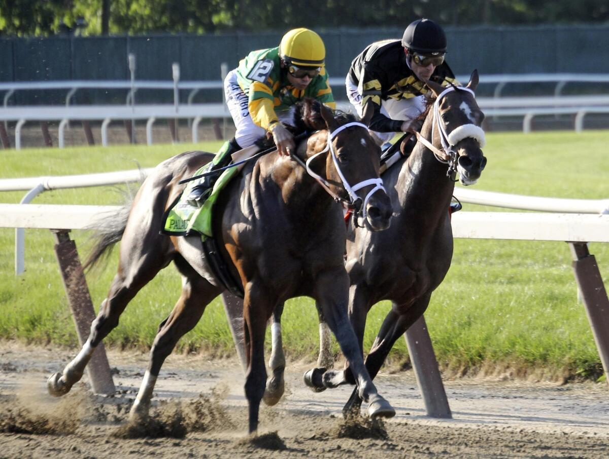 Jockey Mike Smith, left, rides Palace Malice as he races against Oxbow and jockey Gary Stevens during the Belmont Stakes in June. The veteran duo hasn't let their "Geritol Jocks" nickname prevent them from winning on a regular basis.