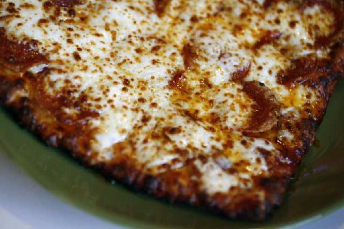 Customers can enjoy a pepperoni pizza at Gardenia Market Deli & Pizzeria in La Crescenta.