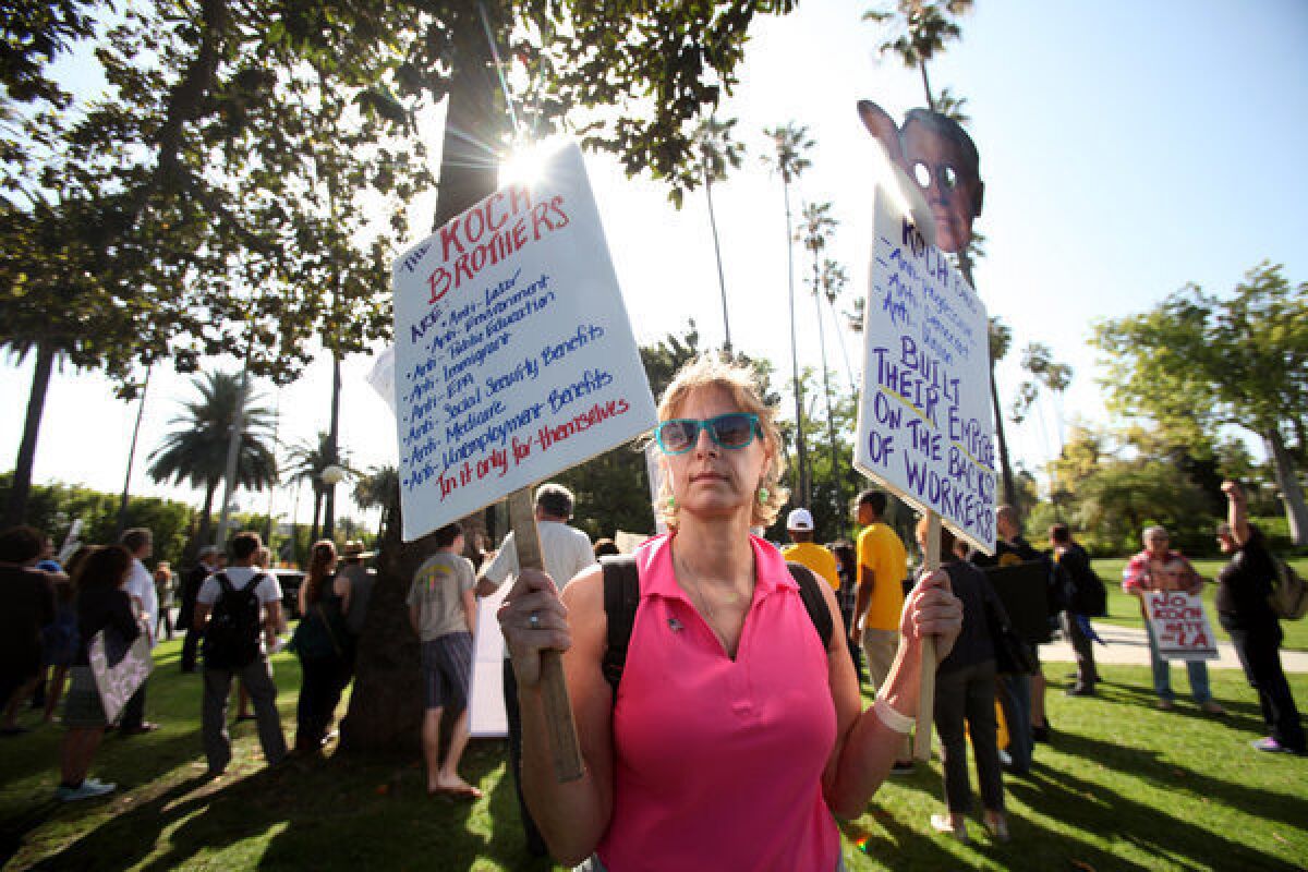 Lesli Lytle, 49, of Los Angeles was one of about 100 people who gathered at Will Rogers State Park to march to the home of Bruce Karsh, chairman of L.A. Times parent Tribune Co., to protest the possible sale of the newspaper to the conservative Koch brothers.