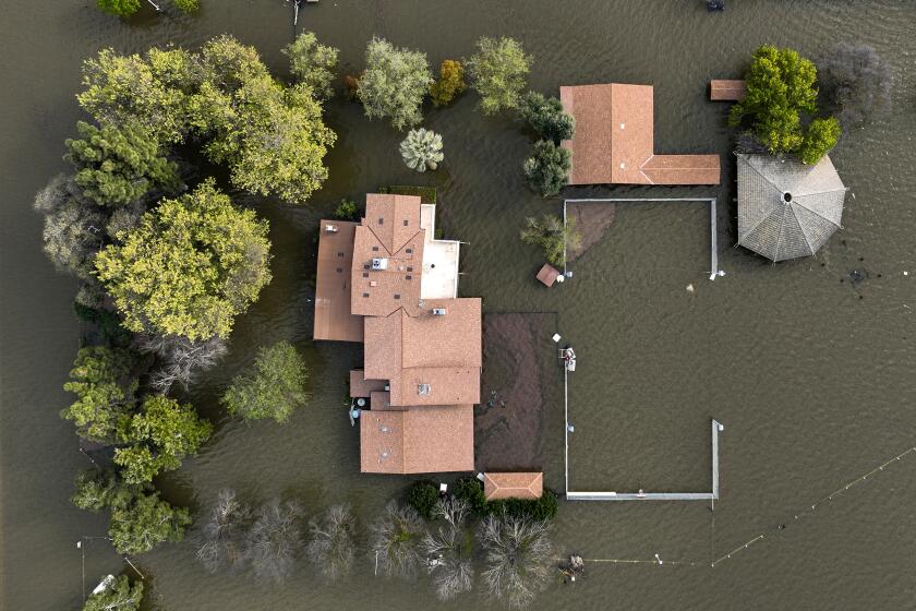Corcoran, CA, Thursday, March 30, 2023 - An estate located just South of Quail Ave. on Sixth St. remains flooded as the resurgence of Tulare Lake continues. (Robert Gauthier/Los Angeles Times)