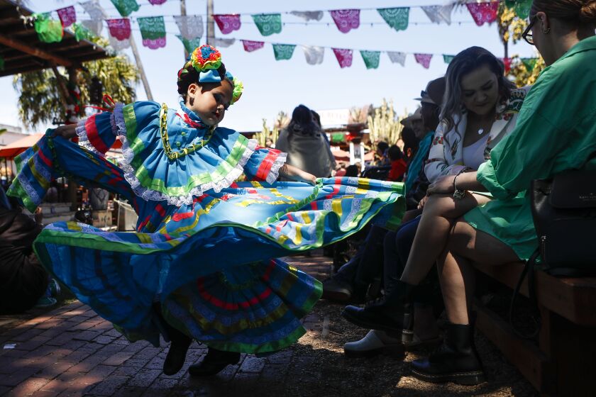 San Diego, CA - May 06: Moncerrath Hernandez, 6, twirls in her dress before performing during Cinco de Mayo Fiesta Old Town within Old Town San Diego State Historic Park on Saturday, May 6, 2023 in San Diego, CA. (Meg McLaughlin / The San Diego Union-Tribune)