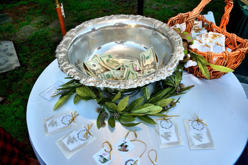 Donations begin to fill the Silver Bowl, for which St. Germaine's Silver Tea is named.