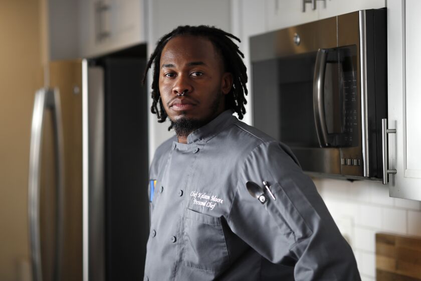 SAN DIEGO, CA - FEBRUARY 16: Chef Kelston Moore is co-founder and co-CEO of Bad Boyz of Culinary, an organization that works to provide resources and programming for young, Black chefs in San Diego, shown here at his home on Wednesday, Feb. 16, 2022 in San Diego, CA. (K.C. Alfred / The San Diego Union-Tribune)