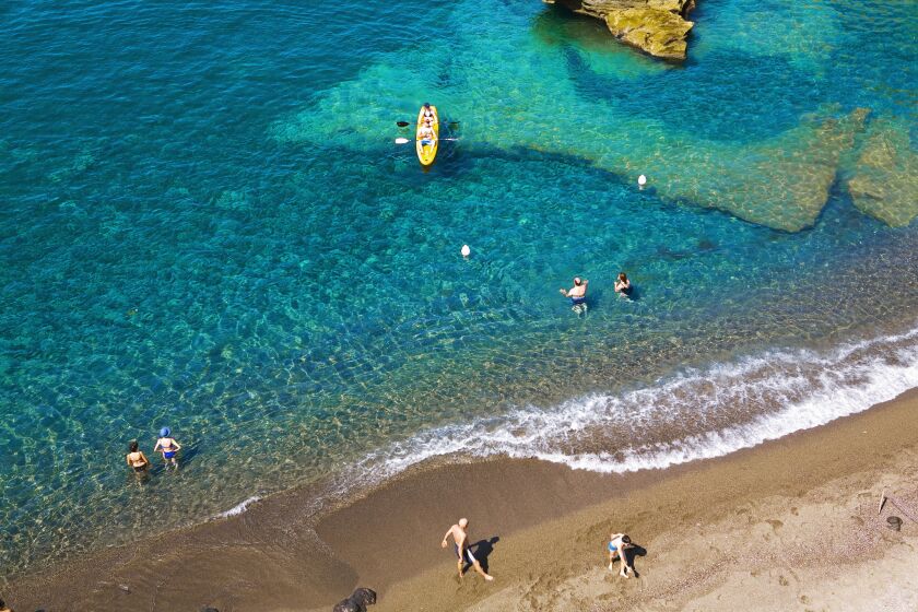 Kayaking and swimming are popular pursuits in the hip beach town of Sant’ Angelo on Ischia.