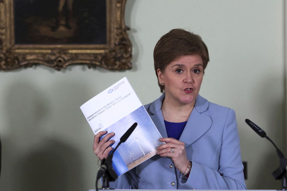 Scotland's First Minister Nicola Sturgeon speaks at a press conference for the launch of new paper on Scottish independence, in Bute House, Edinburgh, Scotland, Tuesday, June 14, 2022. Sturgeon launched her campaign for a second independence referendum on Tuesday, arguing that Scotland would be economically better off outside the United Kingdom. (Russell Cheyne/PA via AP)