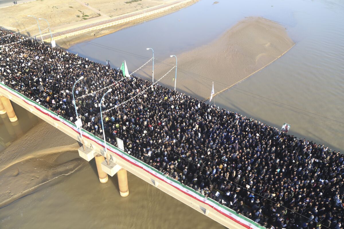 Mourners attend a funeral ceremony for Gen. Qassem Suleimani