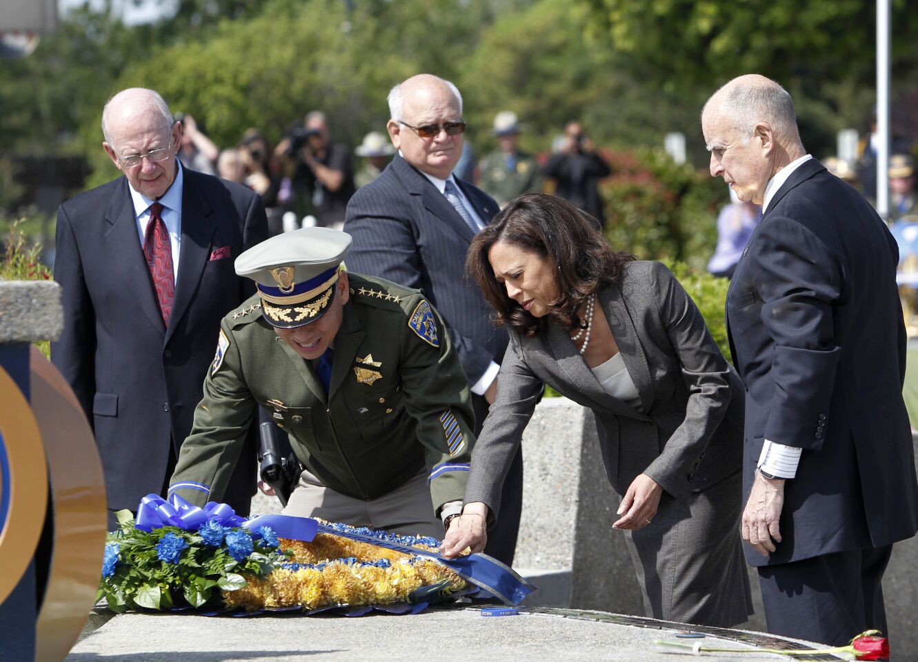 May 7, 2013: CHP Commissioner Joe Farrow and state Atty. Gen. Kamala Harris place a wreath honoring fallen CHP officers.
