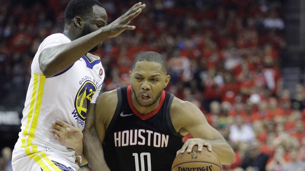 Houston guard Eric Gordon (10) drives around Golden State forward Draymond Green, left, during the second half on Wednesday.