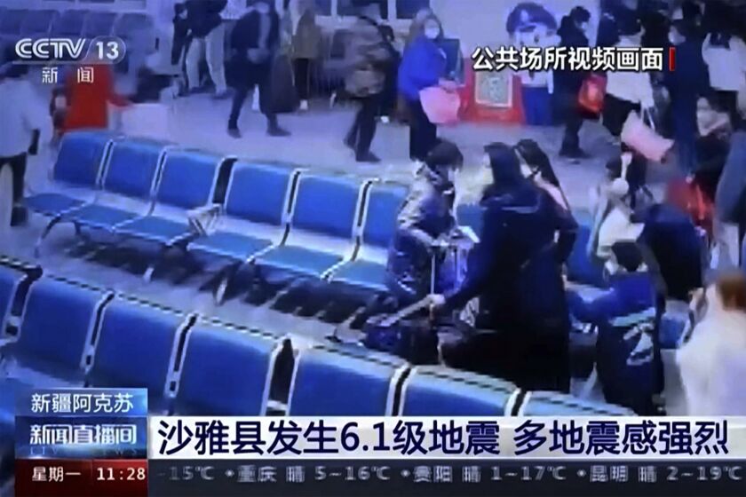 In this image made from video footage run by China's CCTV, passengers evacuate at an unspecified location following a strong earthquake rocked a remote part of China's Xinjiang Autonomous Region, Monday, Jan. 30, 2023. Residents and travelers have sought shelter after a strong earthquake rocked a remote part of northwestern China. No injuries or major damage have been reported following the temblor that struck the Xinjiang region on Monday morning. (CCTV via AP)