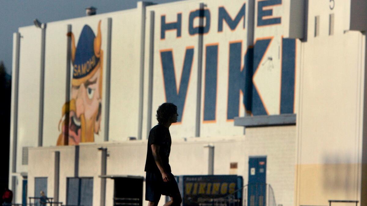 A student practices on the field on the campus of Santa Monica High School.