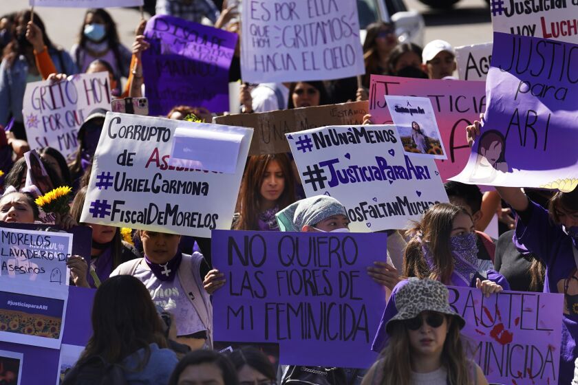 Feminist groups march to protest the murder of Ariadna Lopez, in Mexico City, Monday, Nov. 7, 2022. Prosecutors said Sunday an autopsy on Lopez who was found dead in the neighboring state of Morelos, showed she was killed by blunt force trauma. That contradicts a Morelos state forensic exam that suggested the woman choked on her own vomit as a result of intoxication. (AP Photo/Marco Ugarte)