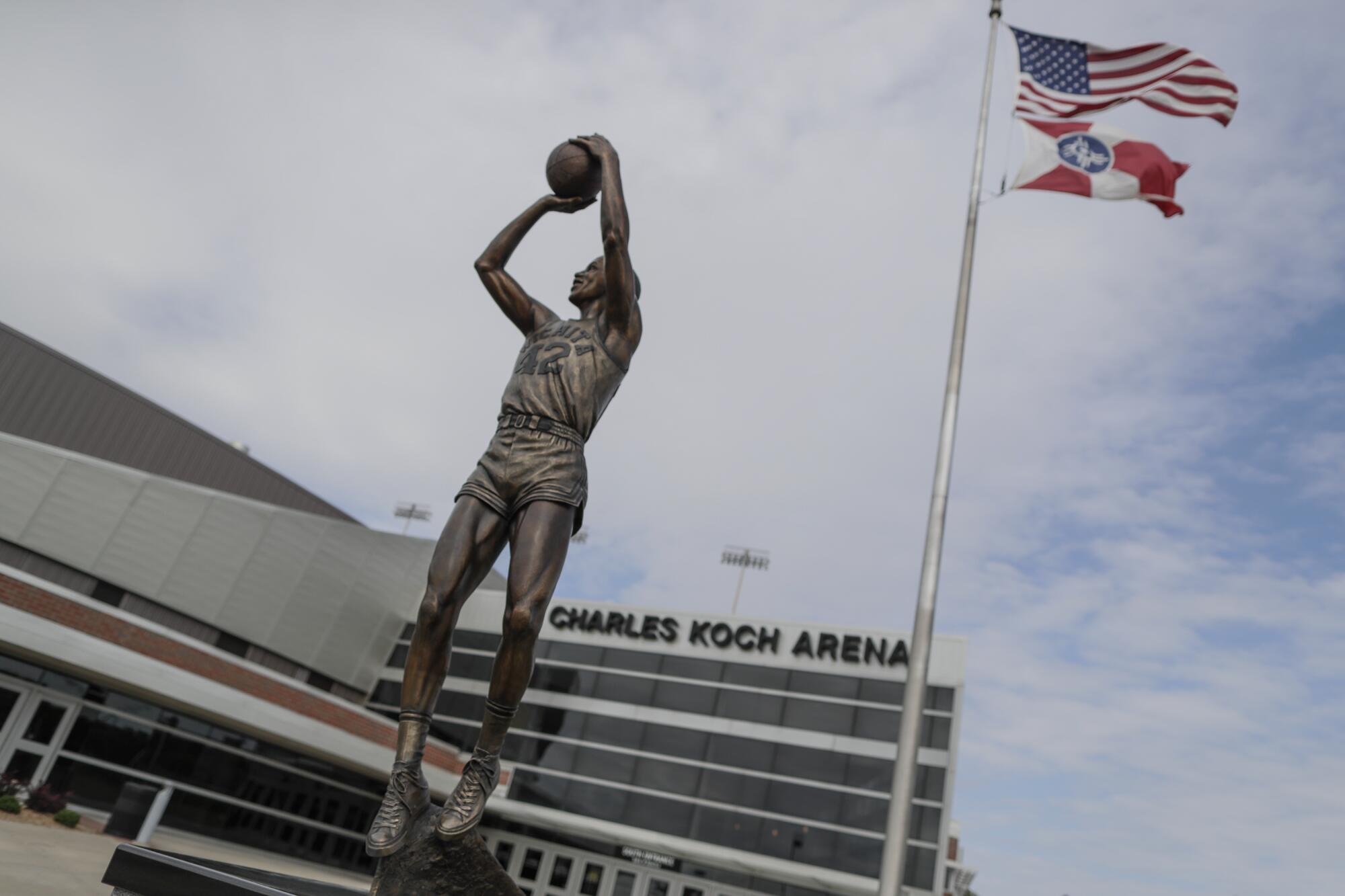 A statue of  Wichita State University basketball player Dave "The Rave" Stallworth at the entrance of Charles Koch Arena.