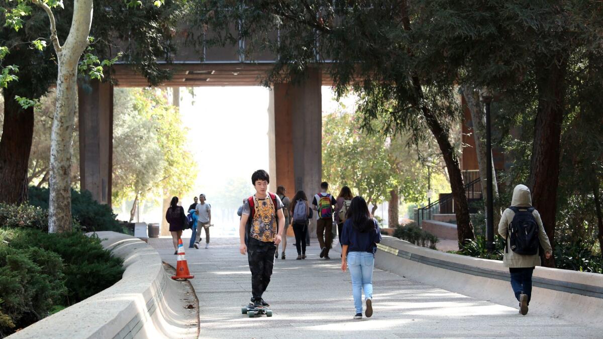 Students walk to and from classes at UCLA on March 1, 2016.