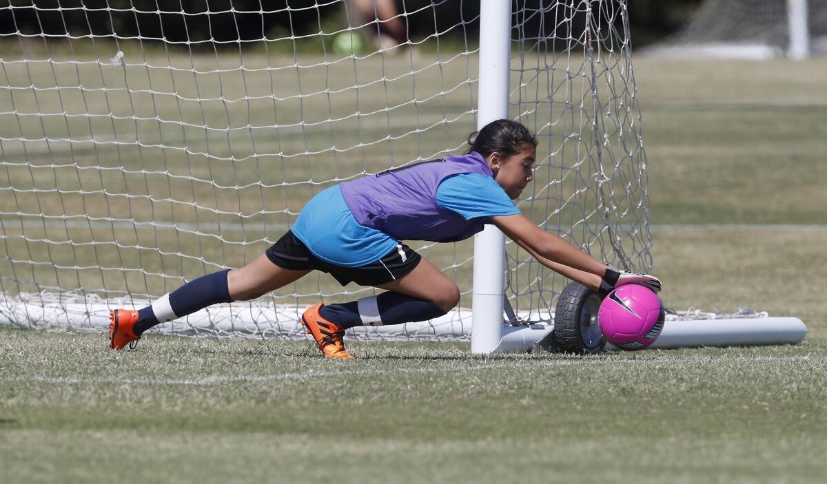 Victoria Elementary goalkeeper Haillie Enciso blocks a shot by Whittier in a girls’ third- and fourth-grade Silver Division pool-play match at the Daily Pilot Cup on Thursday at Jack R. Hammett Sports Complex in Costa Mesa.