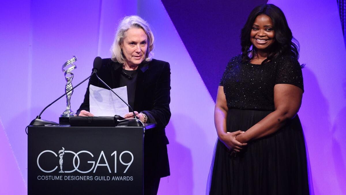 Octavia Spencer, right, reacts when costume designer Renee Ehrlich Kalfus accepts the Excellence in Period Film award for 'Hidden Figures' at the 19th Costume Designers Guild Awards.