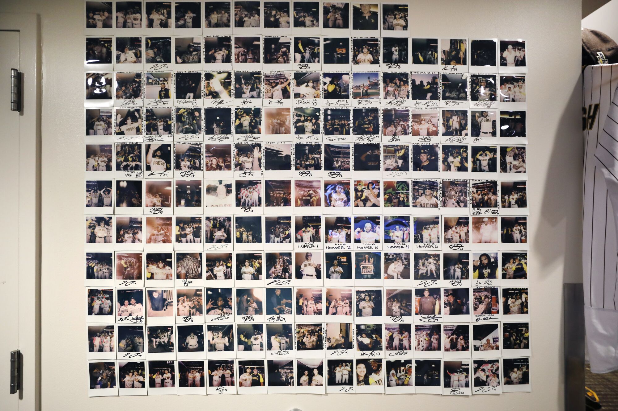 Polaroids taken by Padres players hang in the clubhouse at Petco Park.