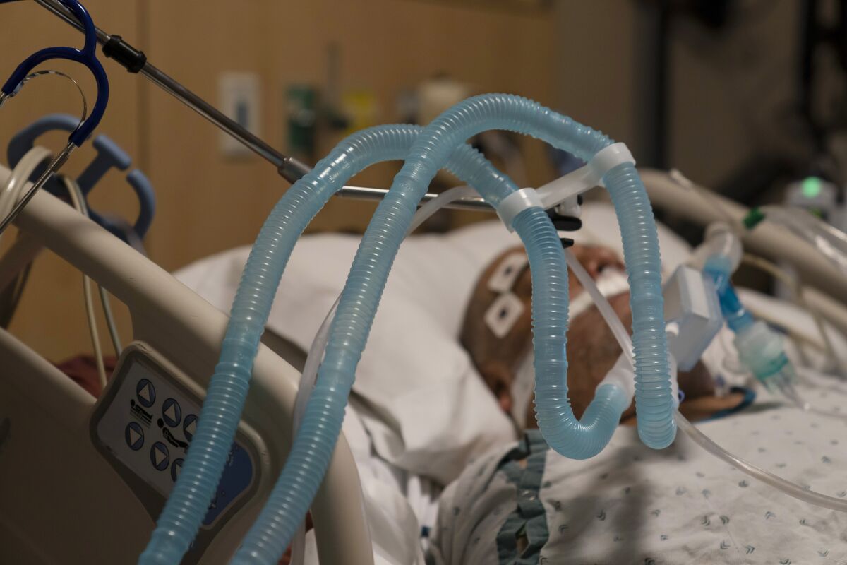 Ventilator tubes are attached to a COVID-19 patient at Providence Holy Cross Medical Center in Mission Hills.