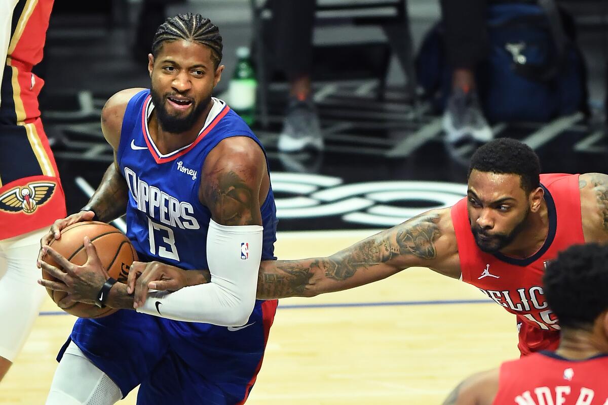 Clippers' Paul George is fouled by New Orleans Pelicans' Sindarius Thornwell.