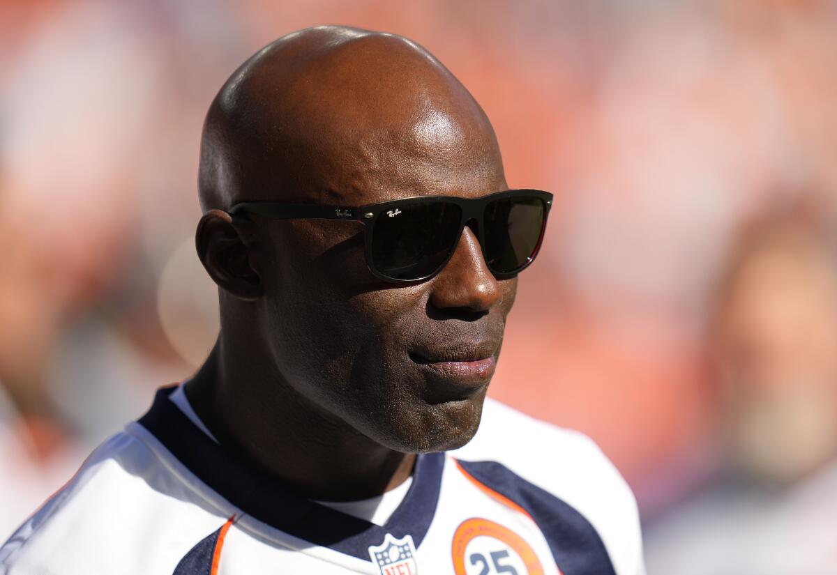 Terrell Davis wears shades during a halftime ceremony.