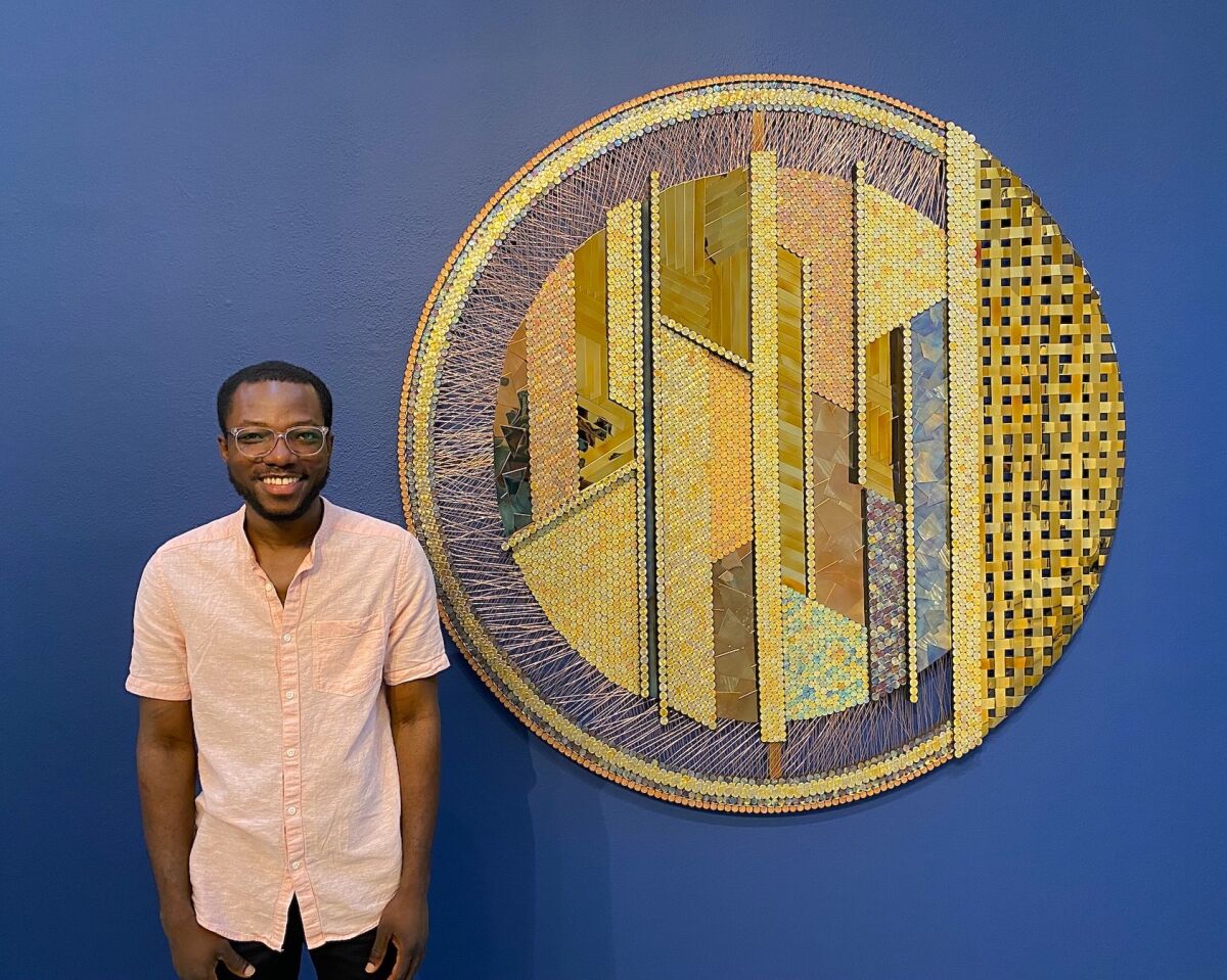 Artist Yaw Owusu with his personal favorite: Same Thing, Different Objects.
