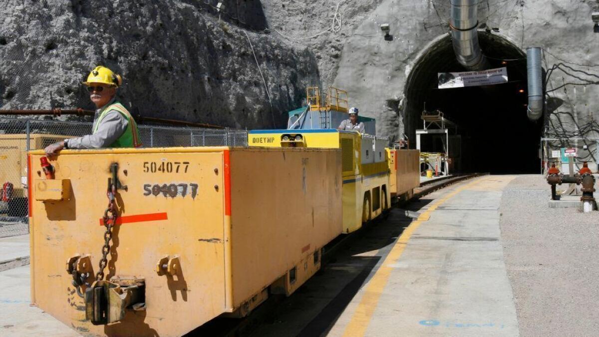 A train emerges from one of the portals at Yucca Mountain in Nevada in 2006.