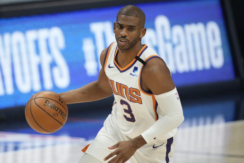 Phoenix Suns guard Chris Paul dribbles the ball during the first half of Game 4 