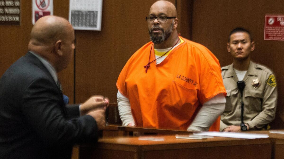 Marion "Suge" Knight appears in Los Angeles Superior Court earlier this month with attorney Matthew Fletcher.