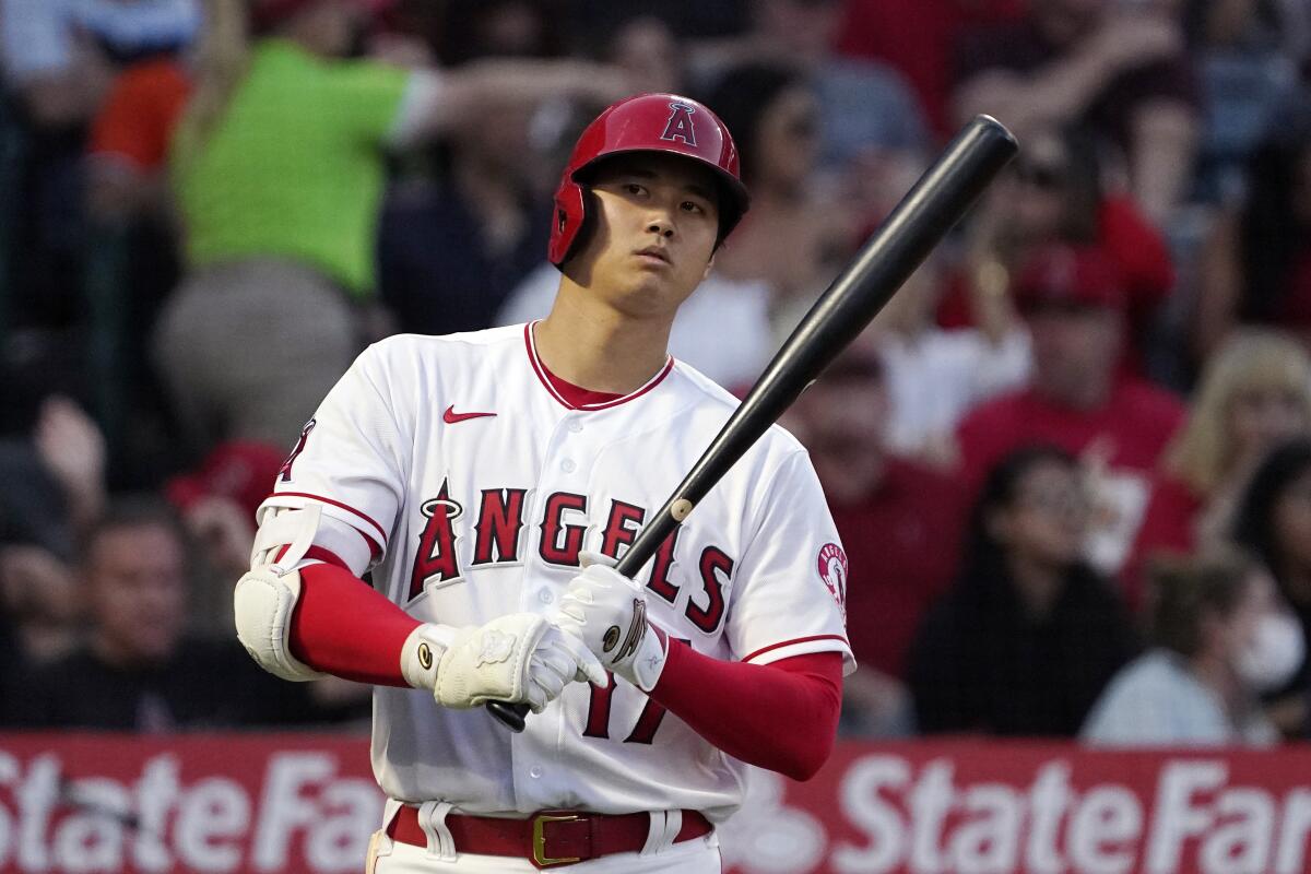 Shohei Ohtani approaches the plate before being intentionally walked during the second inning Saturday.