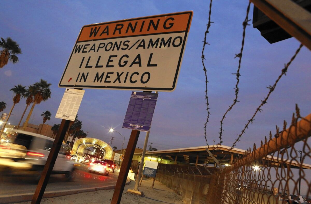 A sign at Calexico's border crossing into Mexico warns against weapons and ammunition. Residents and elected officials say infighting has created a revolving door for public servants, and faith in the police department has dwindled.