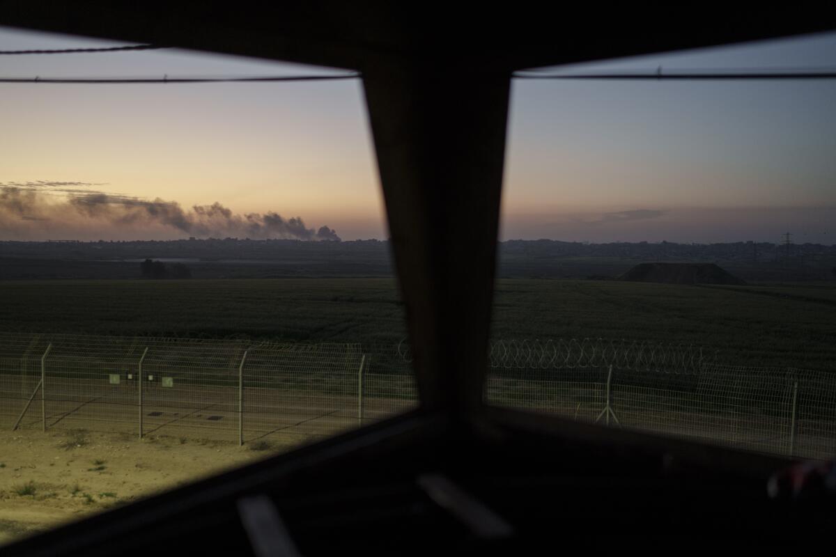 Smoke rises after an explosion in the Gaza Strip, seen from an old observation tower of Kibbutz Nahal Oz, Israel, Wednesday, Feb. 28, 2024. (AP Photo/Leo Correa)