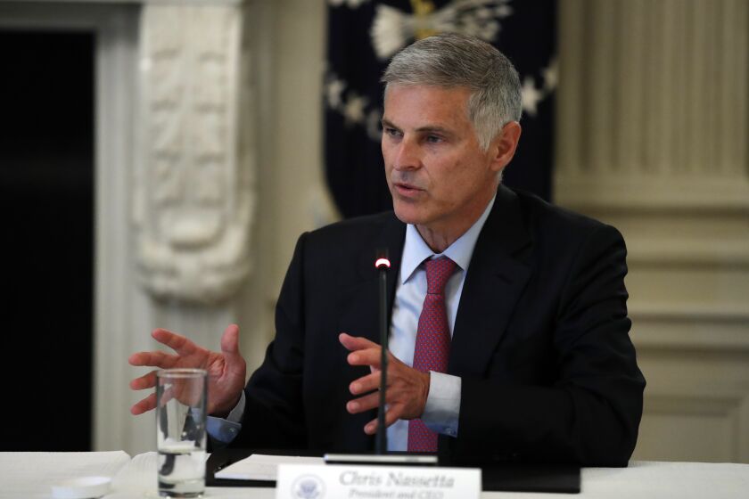 Chris Nassetta, president and CEO of Hilton, speaks about reopening the country, during a roundtable with industry executives, in the State Dinning Room of the White House, Wednesday, April 29, 2020, in Washington. (AP Photo/Alex Brandon)