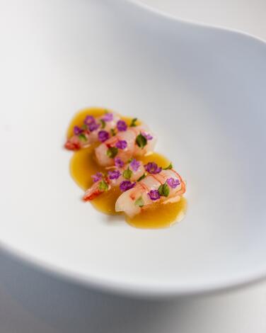 San Diego, CA, May 23 - Ama Ebi Sashimi, Perilla Flowers, Fermented Ginger at Addison, Friday, May 23, 2025 in San Diego, CA. (Deanna Sandoval / For The Times)