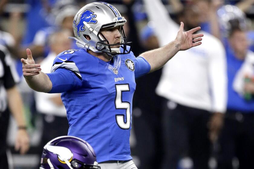 Lions kicker Matt Prater watches his game-winning field goal on the final play of the game against the Vikings on Thursday in Detroit.