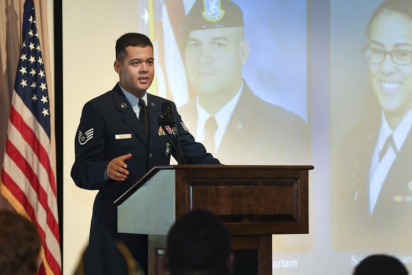 Wilmer Puello-Mota, a member of the 66th Security Forces Squadron, speaks during a gate dedication and renaming ceremony at Hanscom Air Force Base in Massachusetts, on Oct. 2, 2018. Puello-Mota, a U.S. Air Force veteran and former elected official in Massachusetts who fled the U.S. after being charged with possessing sexually explicit images of a child, told his lawyer he joined Russia’s army, and video appears to show him signing documents in a military enlistment office in Siberia, Russia. (Todd Maki/U.S. Air Force via AP)