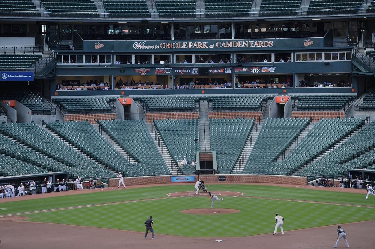 The Baltimore Orioles bat against the Chicago White Sox during Wednesday's baseball game without fans in Baltimore.