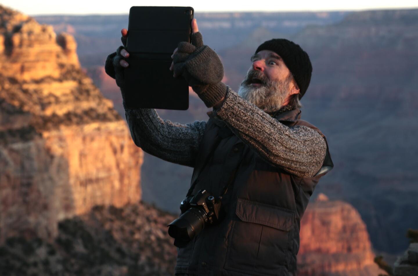 Artist Gregory Zeorlin smiles for a selfie on the South Rim.