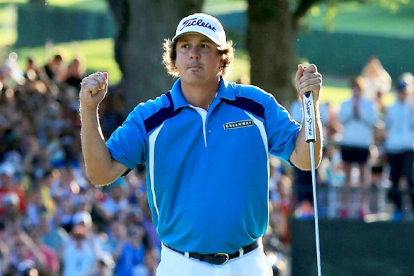 Jason Dufner reacts after tapping in his final putt at No. 18 to clinch the victory in the PGA Championship on Sunday at Oak Hill Country Club.