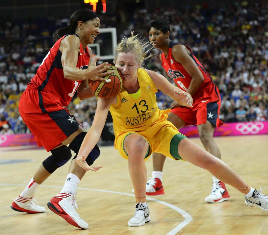 United States' Candace Parker, left, gets a loose ball against Australia's Rachel Jarry in their semifinal game on Thursday.