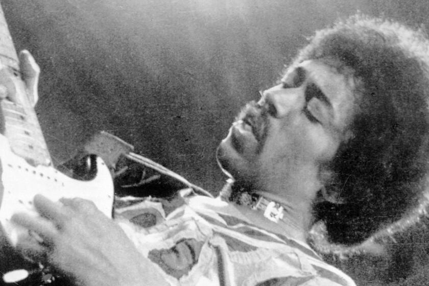 FILE--What originally was envisioned as a small Seattle gallery in of Jimi Hendrix memorabiia has turned into a $50 million to $60 million plan for commemorating popular music and culture in the Pacific Northwest. Hendrix performs in this 1970 photo. (AP Photo/File)