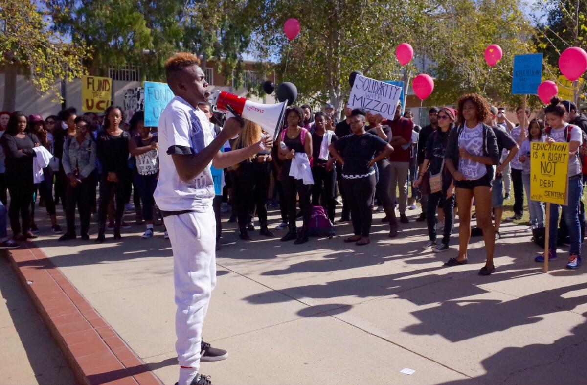 Mohamed Hussein, external vice president of UC Riverside's student government, addresses a crowd of demonstrators.