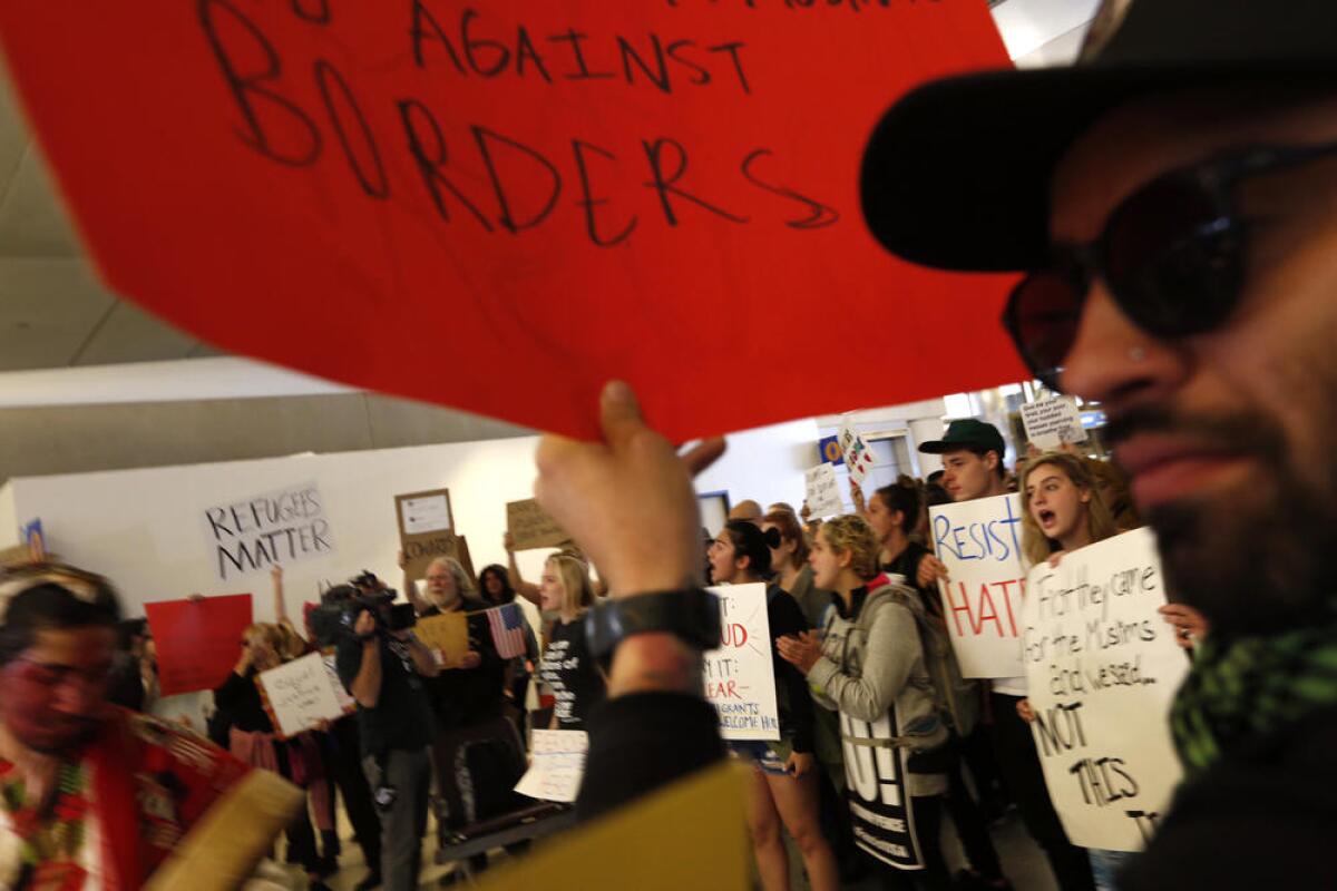 Protesters at LAX on Sunday.