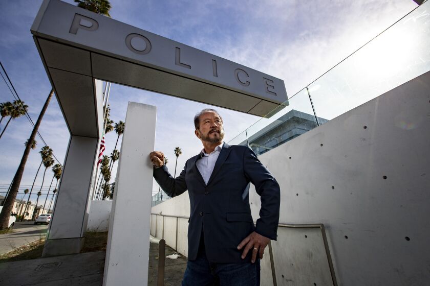 LOS ANGELES, CA - JANUARY 07: Chang Lee, 63, stands for portrait in front of the LAPD Olympic Station on Thursday, Jan. 7, 2021 in Los Angeles, CA. (Brian van der Brug / Los Angeles Times)