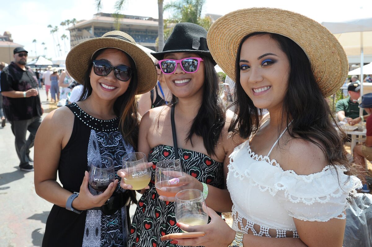 Guests attend a past Uncorked Wine Festival at Del Mar racetrack. This year's event is set for Aug. 14.