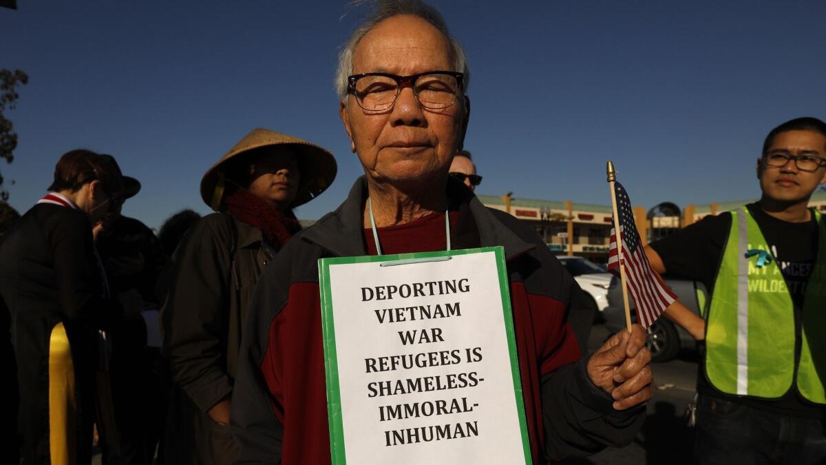 Lan Hoang, 85, center, joins members of the Little Saigon community to protest the Trump administration's move to exclude thousands of Vietnamese from deportation protections.