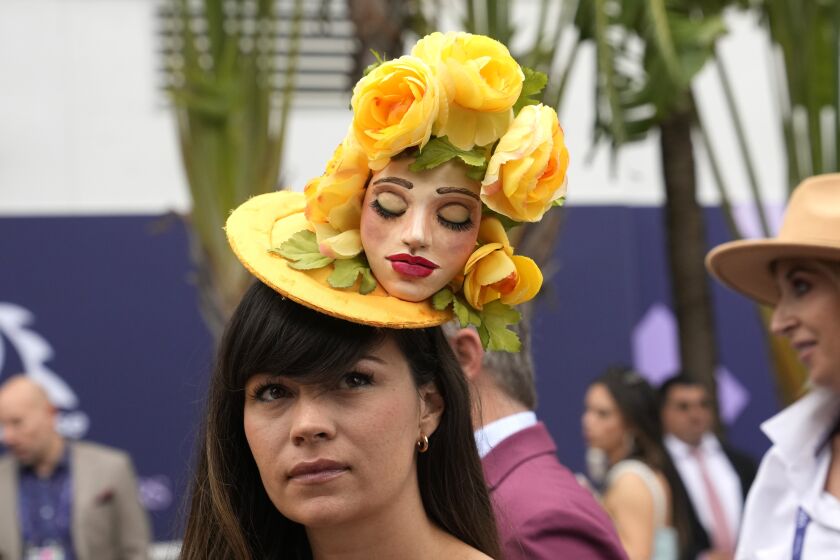Cassandra Youngs wears a handmade hat as she arrives for the Pegasus World Cup Invitational horse race, Saturday, Jan. 28, 2023, at Gulfstream Park in Hallandale Beach, Fla. (AP Photo/Lynne Sladky)