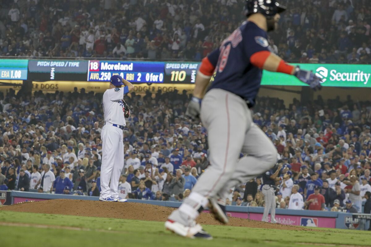 Dodgers reliever Ryan Madson wipes sweat from his brow as Boston Red Sox's Mitch Moreland rounds the bases on a three-run seventh inning homer.