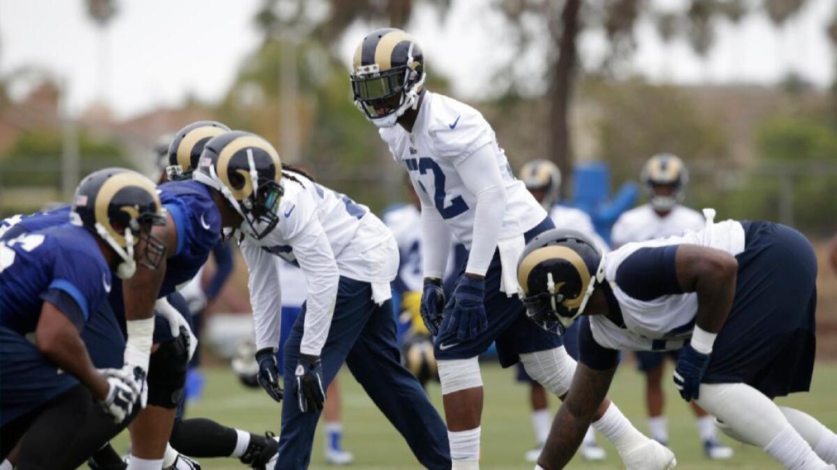 Middle linebacker Alec Ogletree lines up with the first-team defense during organized team activities on June 1.