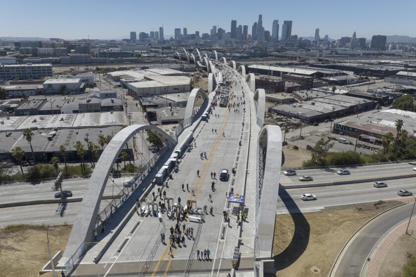 LOS ANGELES, CA - JULY 09: The 6th Street Viaduct was open to pedestrians during a community celebration on Saturday, July 09, 2022. The $588-million project took more than six years to complete. The weekend celebration featured live music, food, a market, vintage car display and a fireworks show on Saturday night. The bridge will officially open to cars on Sunday at 7 p.m. (Myung J. Chun / Los Angeles Times)