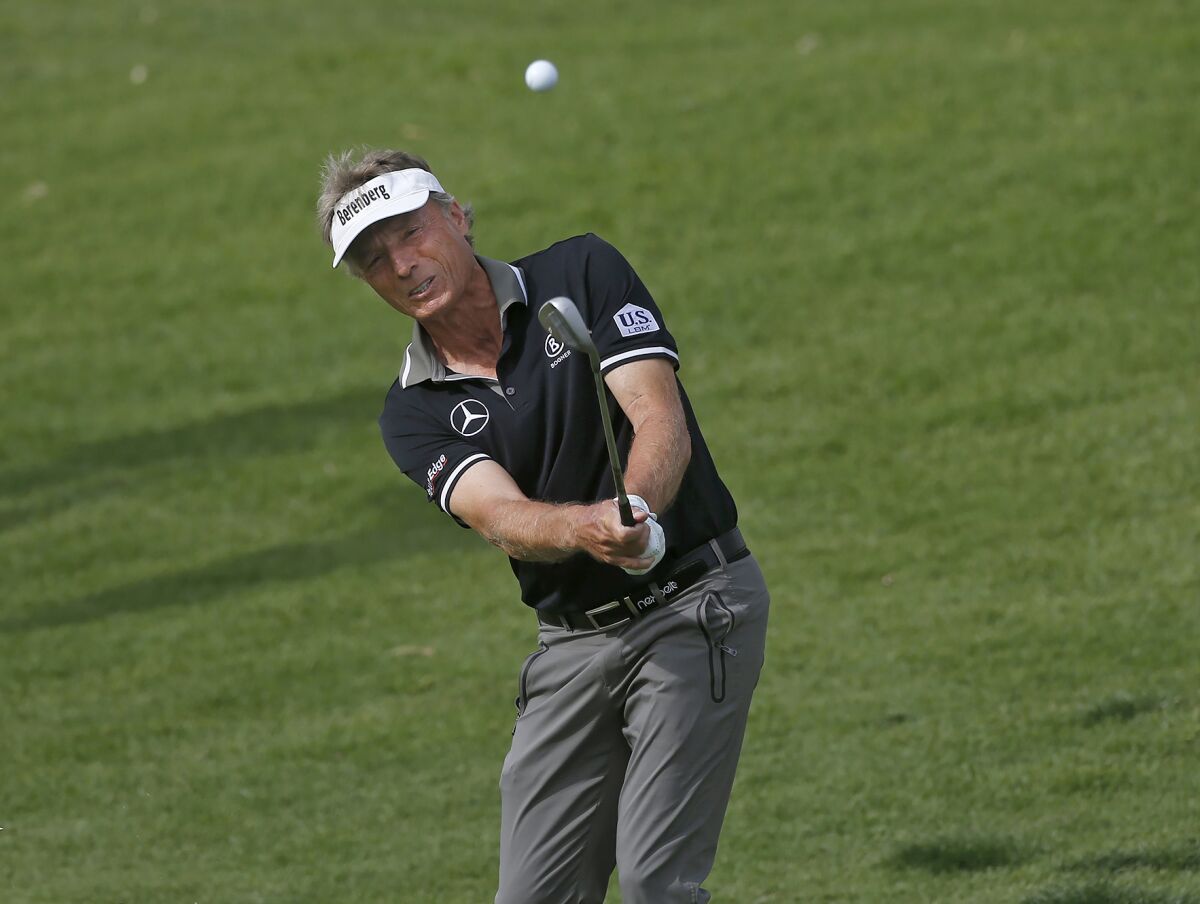 Bernhard Langer chips onto the 18th hole during the Hoag Classic golf tournament at Newport Beach Country Club on Saturday.