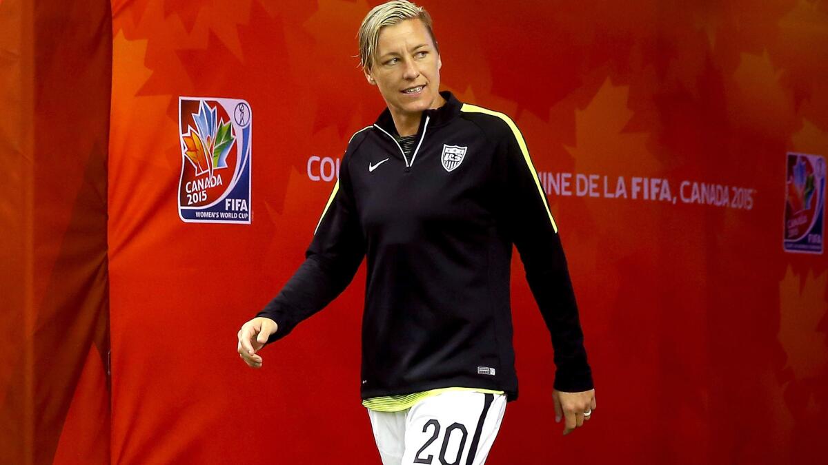 Abby Wambach walks to the pitch before the U.S. defeated Germany, 2-0, in the Women's World Cup semifinal on June 30 in Montreal.